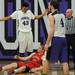 Pioneer High School's Tevis Robinson stands over guard Bedford High School's Adam Swisher after being called for a foul during the second quarter at Pioneer on Tuesday, Feb. 19, 2013. Melanie Maxwell I AnnArbor.com